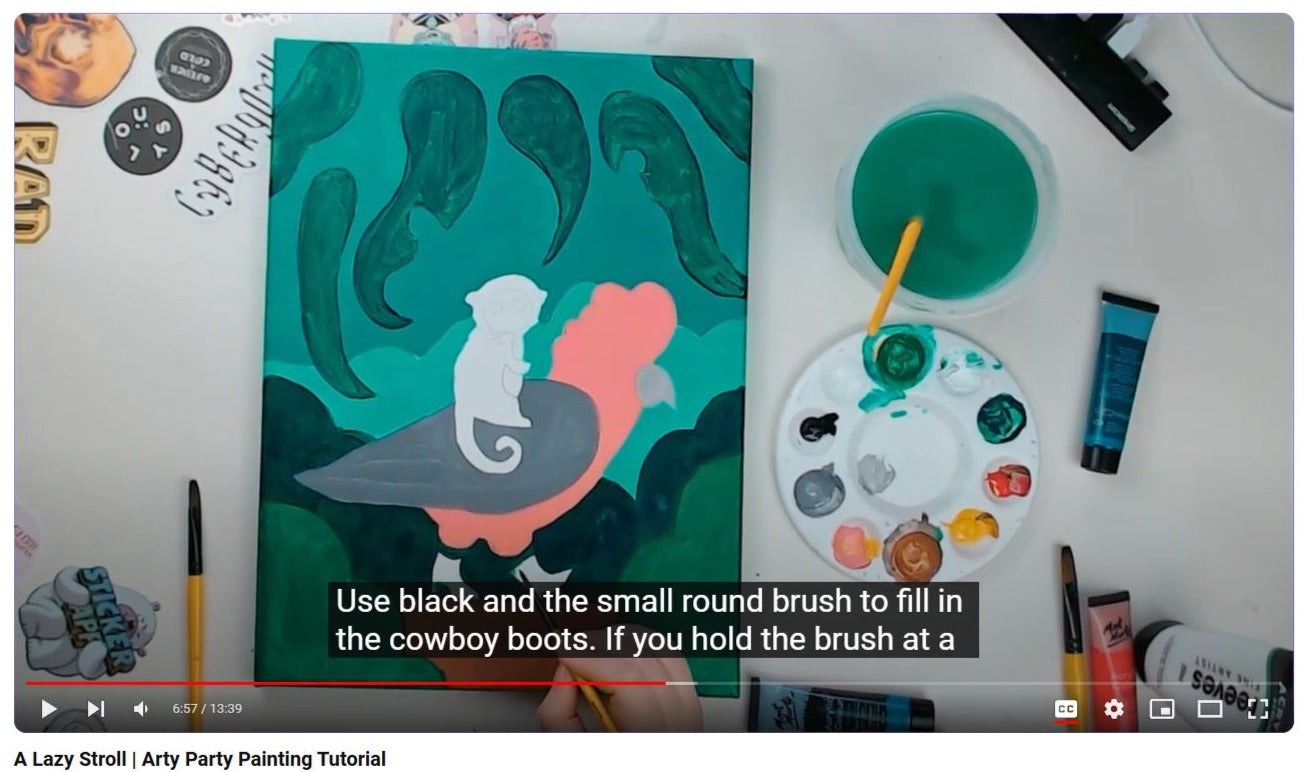 A screen shoit of a youtube video at the halfway point. The screen is showing an unfinished acrylic painting with subtitles explaining clearly how to do the next step in the painting. It is the Arty Party Kits youtube page.