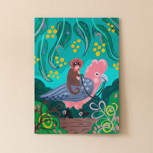 Image shows a painted canvas completed using the Arty Party Kits 'A Lazy Stroll' acrylic painting kit for beginners. It features a cartoon Galah with a tiny Possum riding it's back. They are in the middle of a green forest scene with eucalyptus leaves above them.