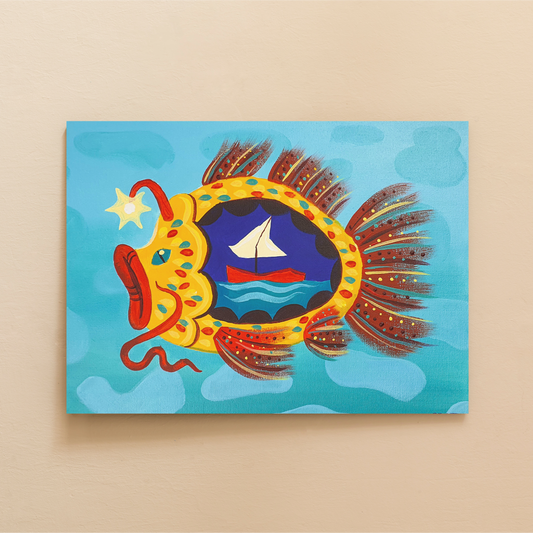 Image shows a painted canvas completed using the Arty Party Kits 'The Terrible Dogfish' acrylic painting kit for beginners. It depicts a teal/blue water background with a yellow fish in the foreground. The fish fills up most of the canvas and has thick red lips, antenna, whiskers and fins/tail. It has blue and red scales. There is a 'cut out' where you can see into its stomach, where there is a broken boat. 